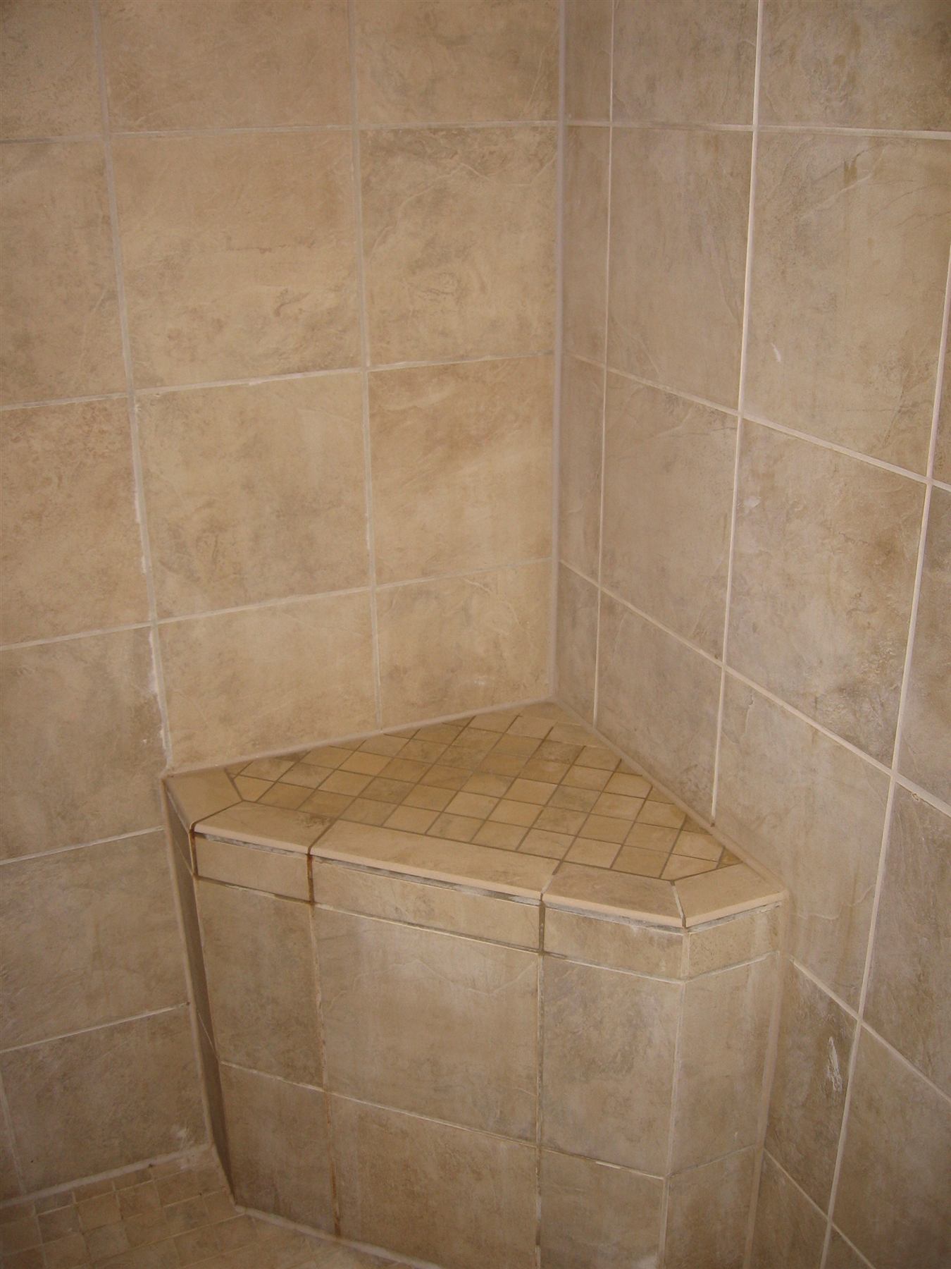 Custom tiled shower with built-in bench seat